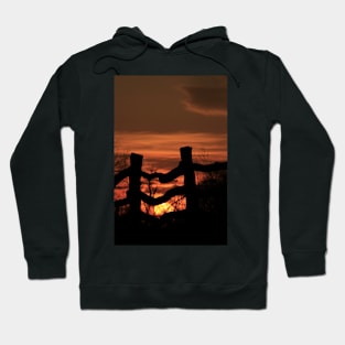 Wooden Fence with a colorful Kansas Sunset Hoodie